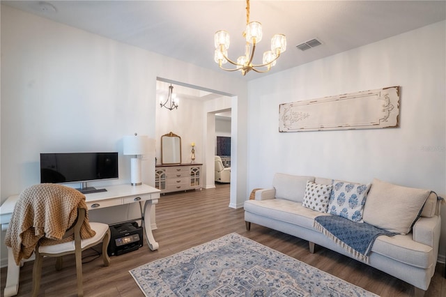 office area featuring dark hardwood / wood-style flooring and a notable chandelier