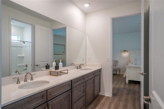 bathroom with vanity and wood-type flooring