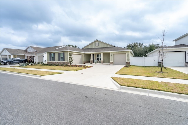 view of front facade with a garage and a front yard