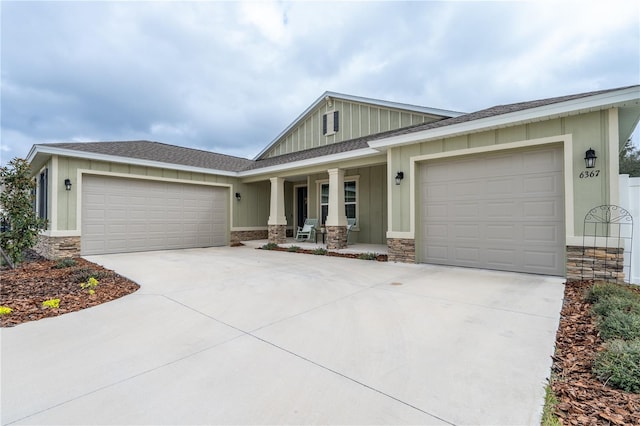 view of front of home with a porch and a garage