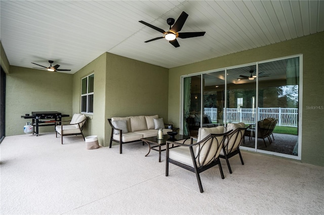 view of patio with ceiling fan and an outdoor living space