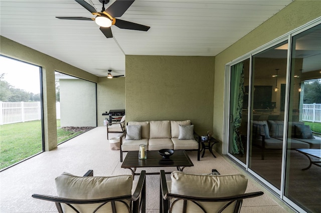 sunroom / solarium with ceiling fan