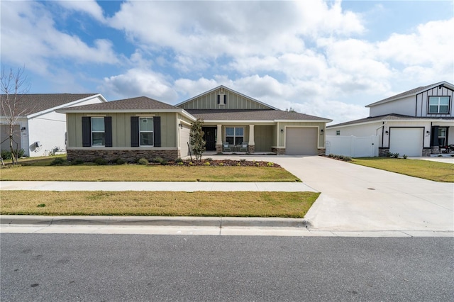 view of front of house featuring a garage and a front yard