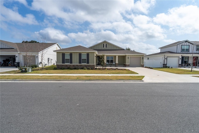 view of front of house with a garage and a front lawn