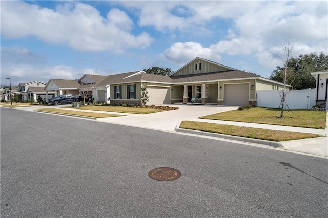 view of front of house featuring a garage and a front yard