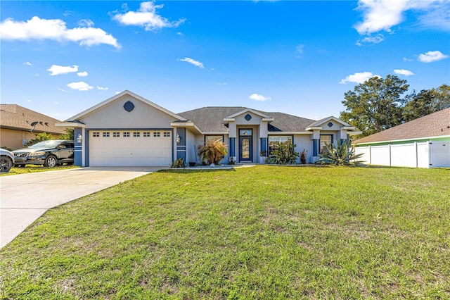 ranch-style home featuring stucco siding, concrete driveway, an attached garage, a front yard, and fence