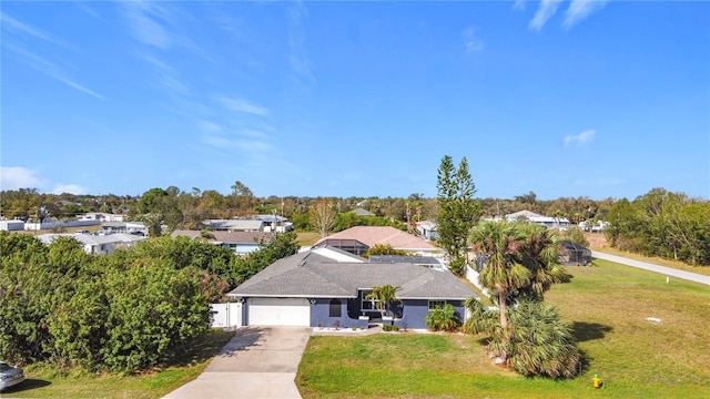 2457 Tamworth Ter, Punta Gorda, FL 33983 - ranch-style home featuring driveway, a front lawn, an attached garage, and a residential view