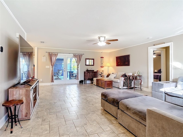 living room with ceiling fan, ornamental molding, and french doors