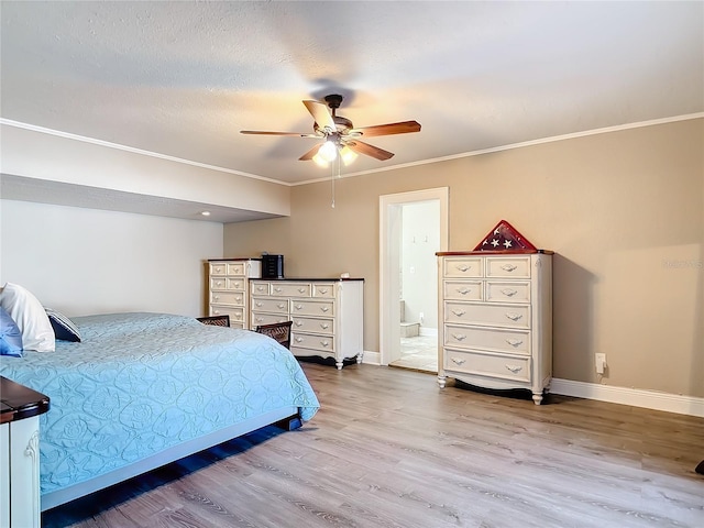 bedroom featuring a textured ceiling, hardwood / wood-style flooring, ceiling fan, and ornamental molding