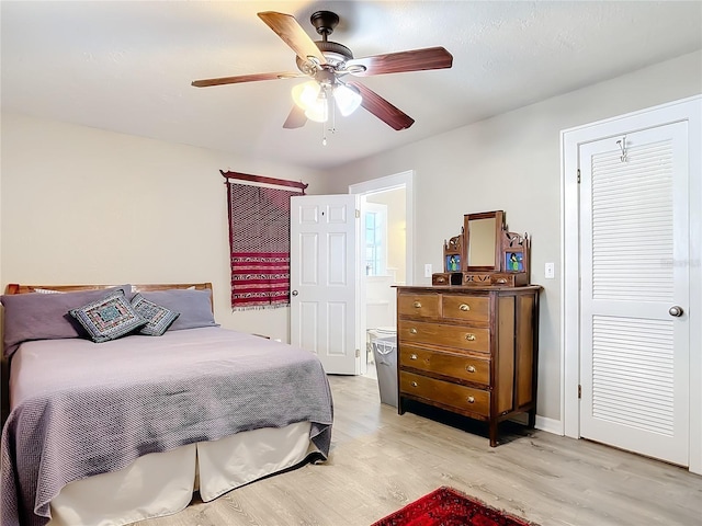 bedroom with light wood-type flooring and ceiling fan