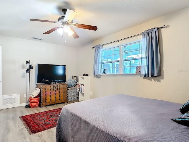 bedroom featuring light wood-type flooring and ceiling fan