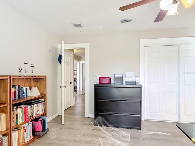 interior space featuring light wood-type flooring and ceiling fan