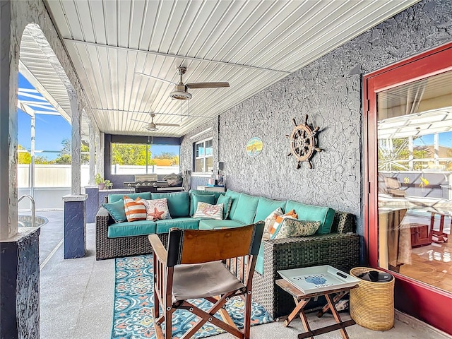 view of patio with outdoor lounge area and ceiling fan