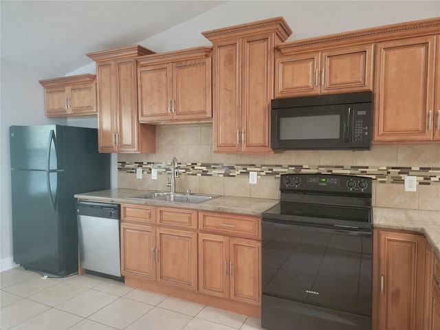 kitchen with black appliances, a sink, light tile patterned floors, decorative backsplash, and lofted ceiling