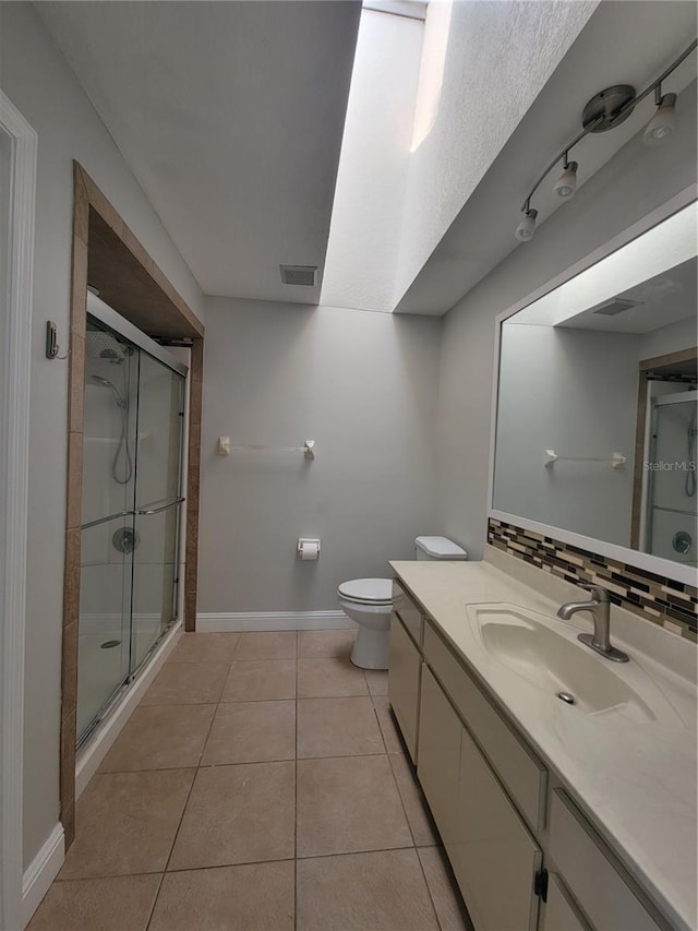 full bath featuring tasteful backsplash, visible vents, a shower stall, tile patterned floors, and vanity