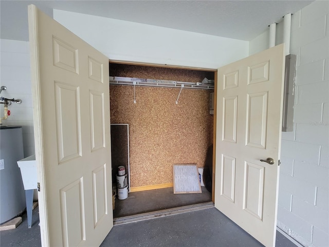 closet featuring electric panel and water heater