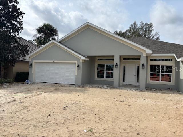 ranch-style house featuring a garage