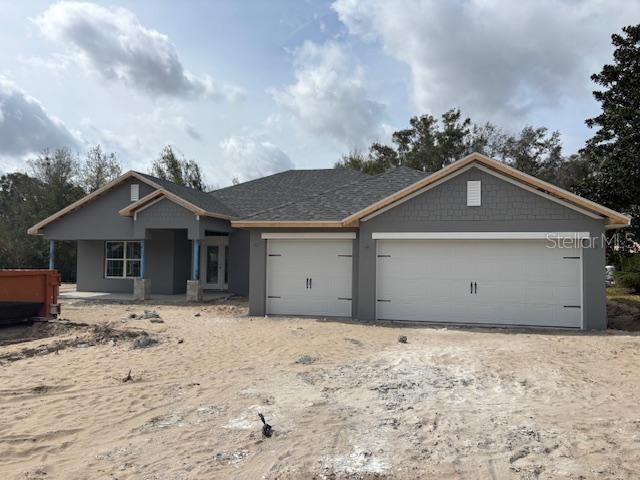 view of front of property with a garage