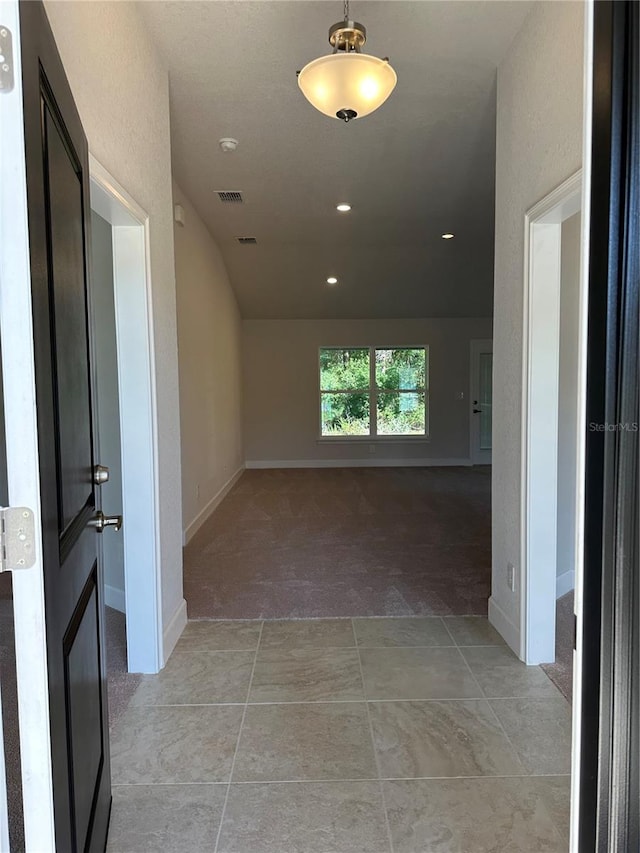 hallway with light carpet