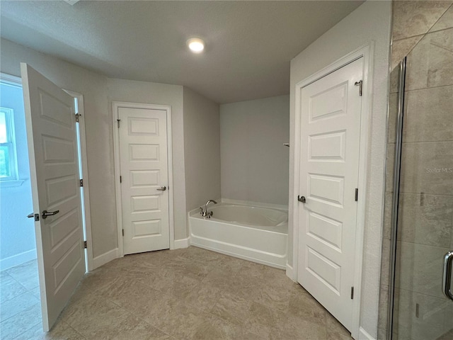 bathroom featuring plus walk in shower