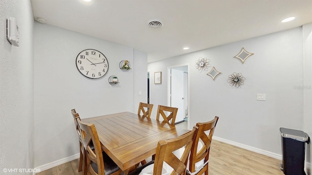 dining room featuring light hardwood / wood-style floors