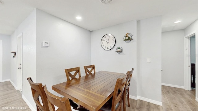 dining room featuring light hardwood / wood-style floors