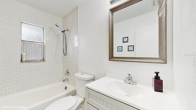 full bathroom with tiled shower / bath combo, vanity, and toilet