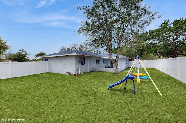 view of yard featuring a playground