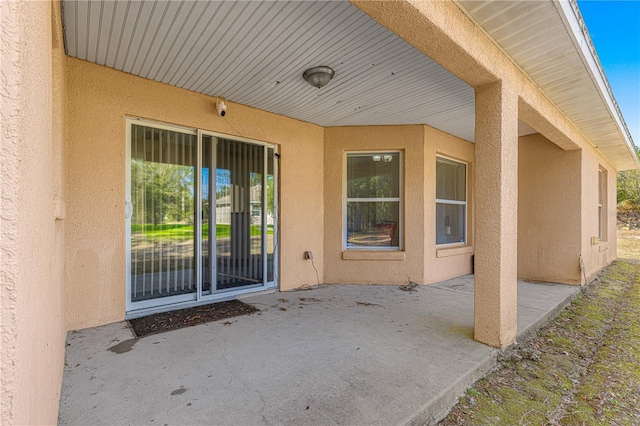 entrance to property with a patio area