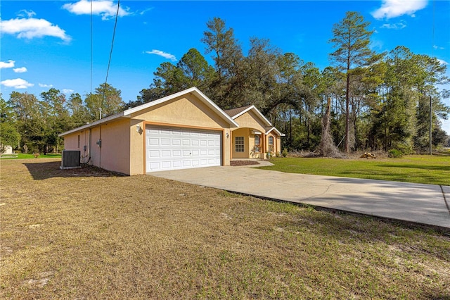 view of home's exterior with a garage and a yard