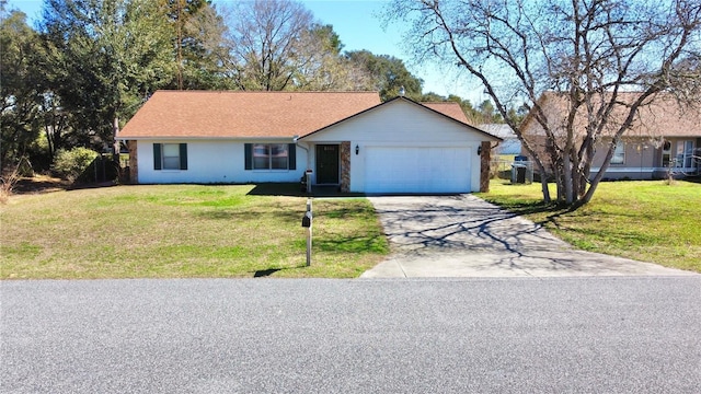 single story home with a garage and a front lawn