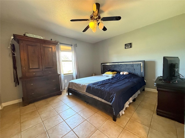 bedroom featuring light tile patterned flooring and ceiling fan