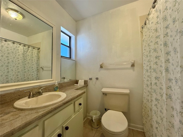 bathroom featuring tile patterned floors, toilet, curtained shower, and vanity