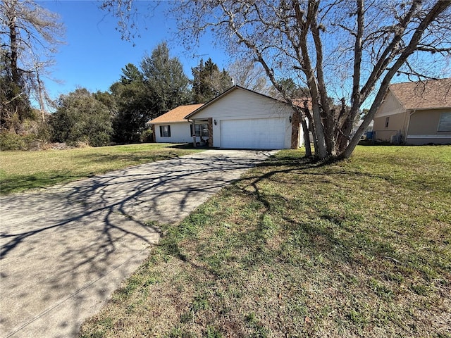 view of front of house featuring a garage and a front lawn