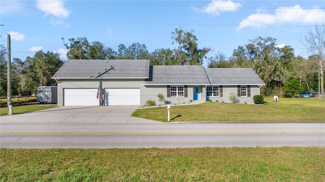 ranch-style home featuring a garage and a front yard