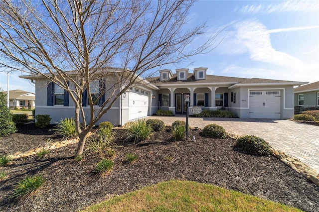 view of front facade featuring a garage and a porch