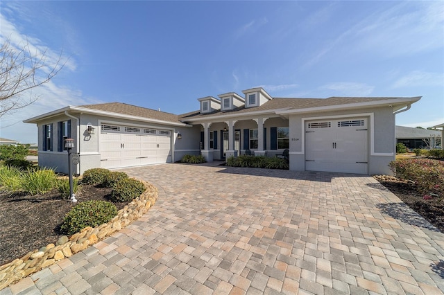 view of front of home with a garage and covered porch