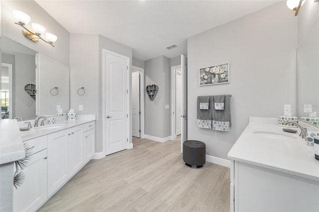 bathroom featuring hardwood / wood-style flooring and vanity