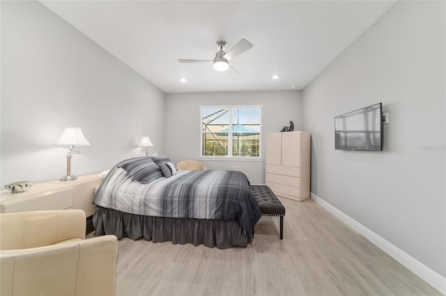 bedroom featuring ceiling fan and light hardwood / wood-style floors