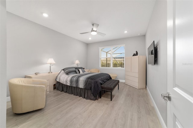 bedroom with ceiling fan and light wood-type flooring