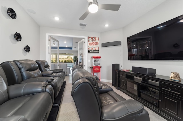 living room with light carpet and ceiling fan