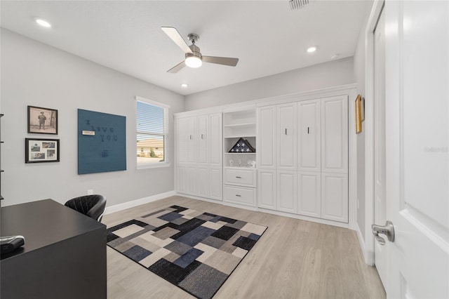 office area with ceiling fan and light hardwood / wood-style flooring