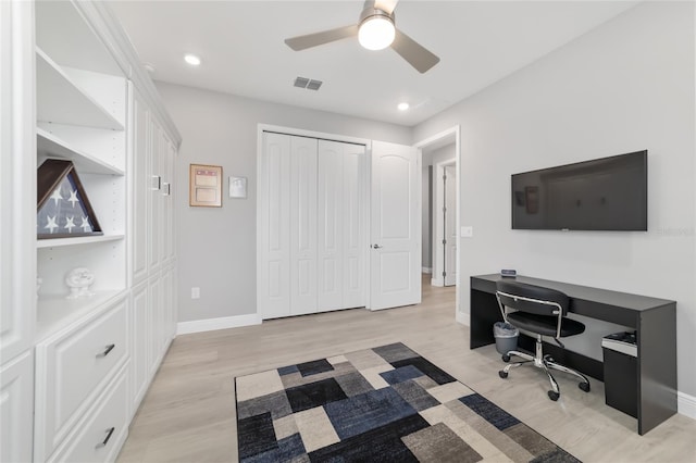 office space featuring light hardwood / wood-style flooring and ceiling fan