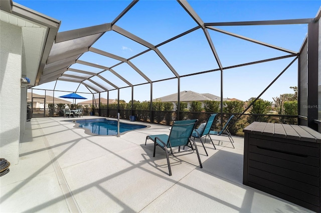 view of pool with a lanai and a patio area