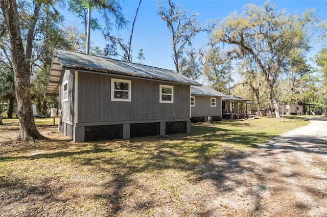 view of home's exterior with a yard