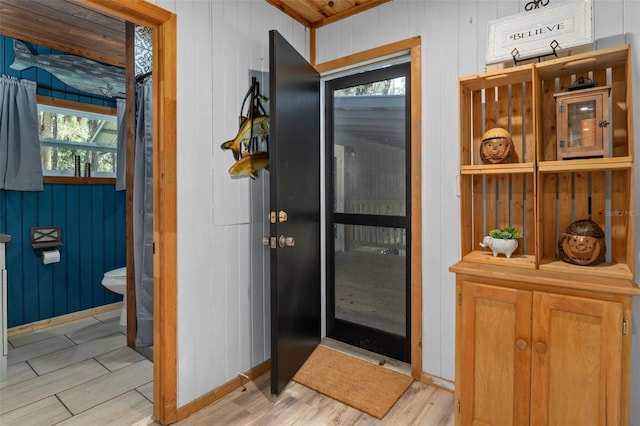 bathroom with hardwood / wood-style flooring and toilet