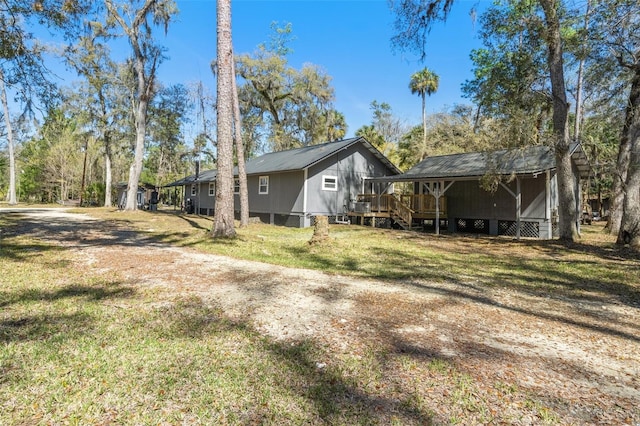 view of side of home featuring a lawn