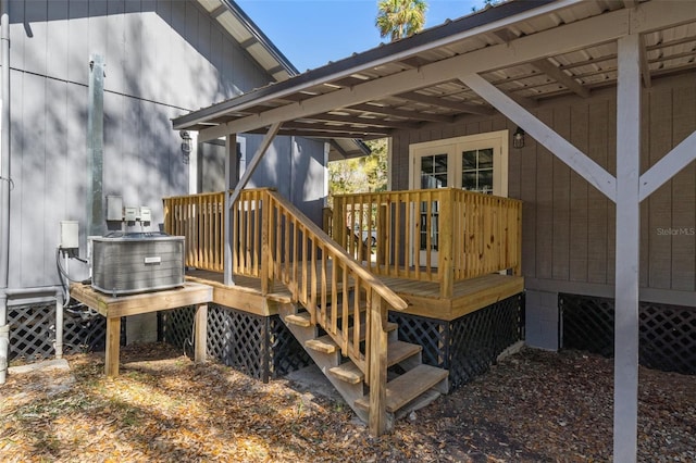 wooden terrace featuring cooling unit