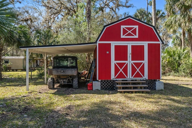 view of outbuilding with a yard