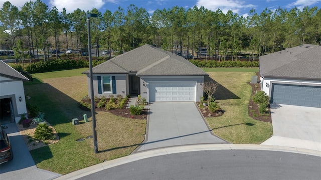 ranch-style home with roof with shingles, stucco siding, an attached garage, driveway, and a front lawn